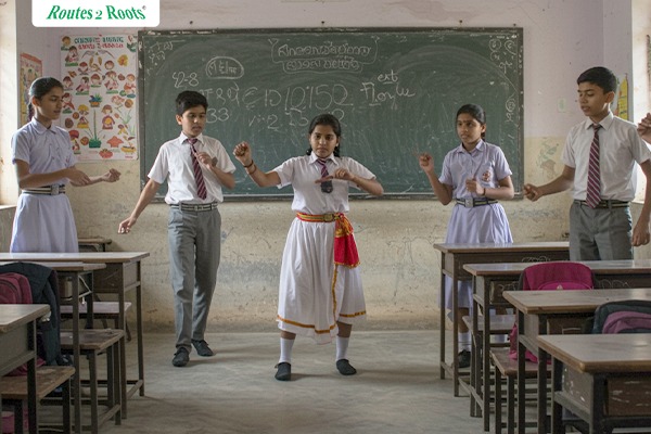Young artists performing and interacting during a cultural competition, showcasing growth and creativity